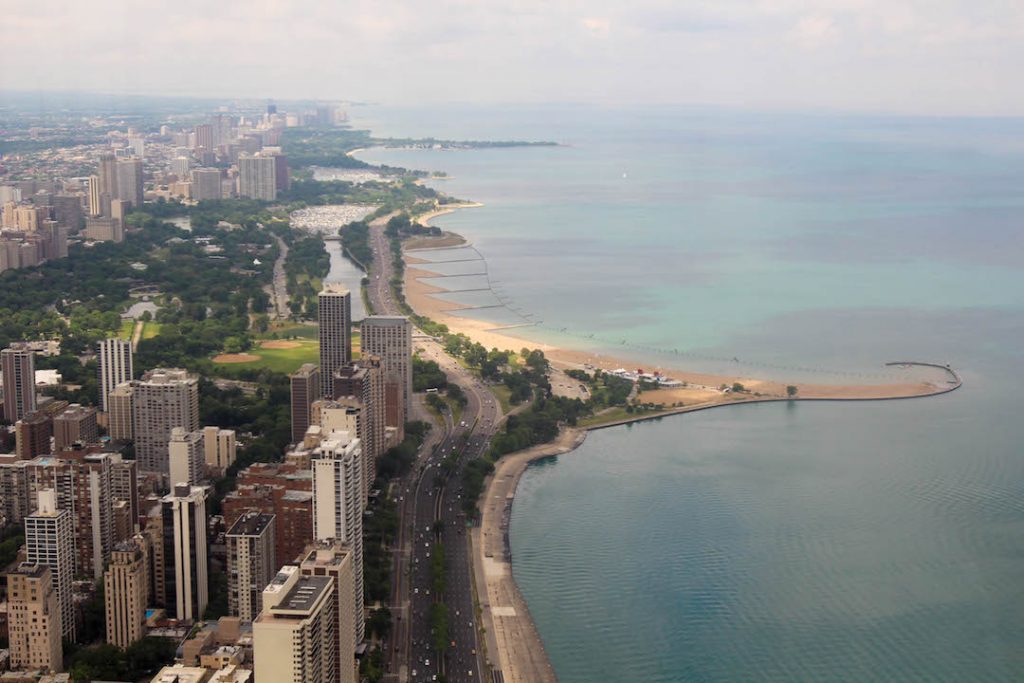 looking down at the buyildings and beach in chicago