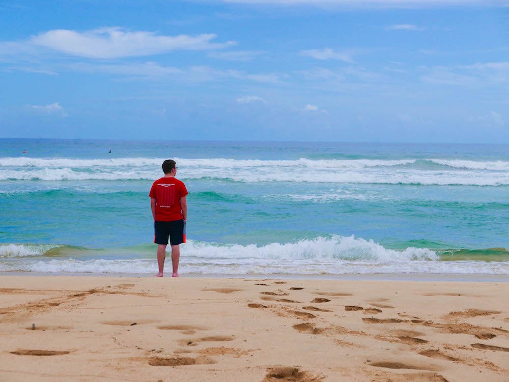 Daniel staring out towards the horizon on Wizard Beach, Isla Bastimentos, Panama