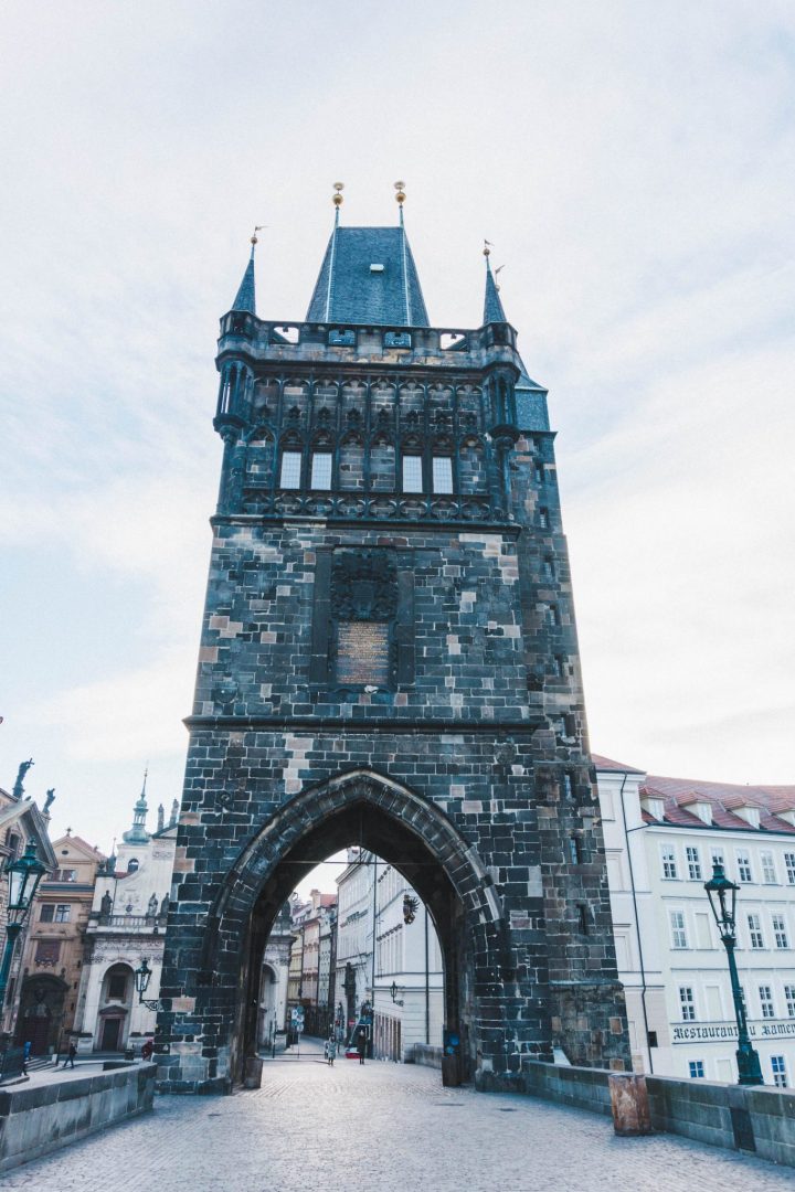 The imposing gate entrance to Charles Bridge in Prague