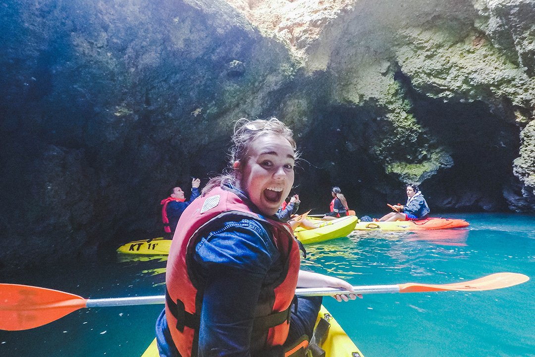 Madison looking super excited while in a tiny cave on our Kayak Tour in Lagos, Portugal