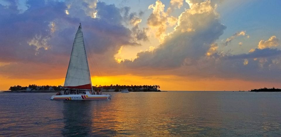 A sailboat at sunset in Key West, Florida - one of the best fall vacations in the US!