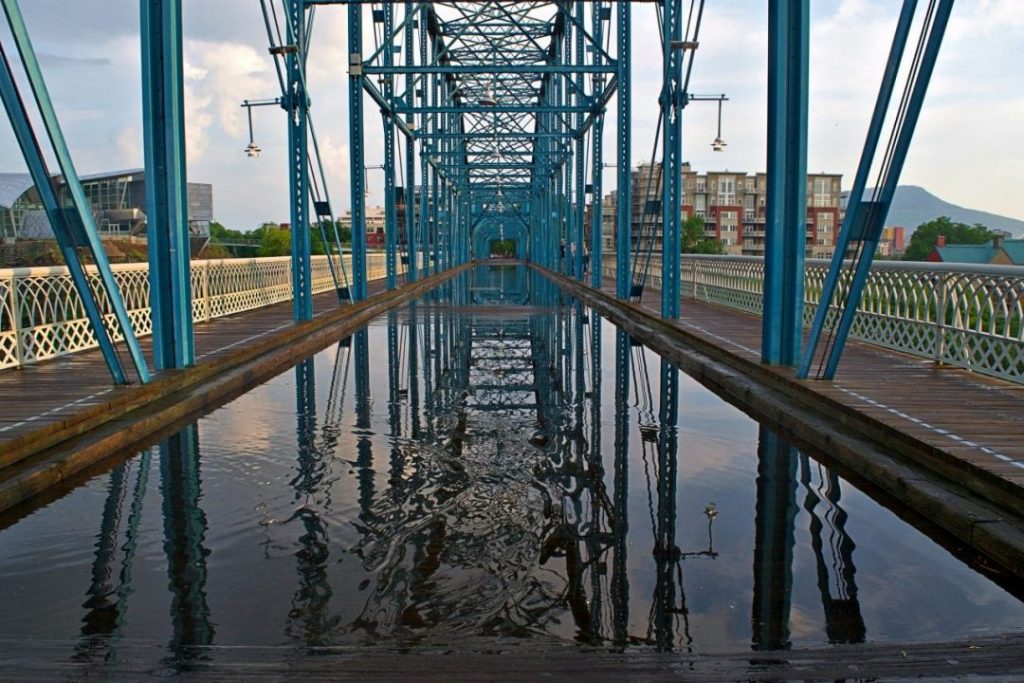 Water reflecting the Walnut Street Bridge in Chattanooga, TN