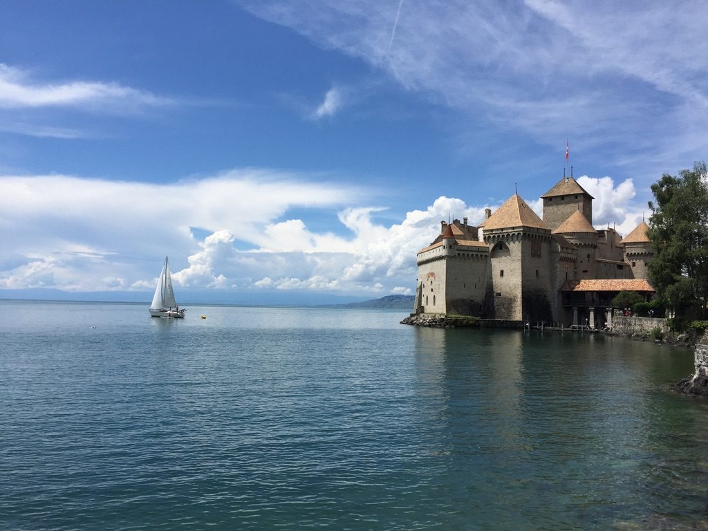 A castle on the edge of a lake in Montreux, Switzerland