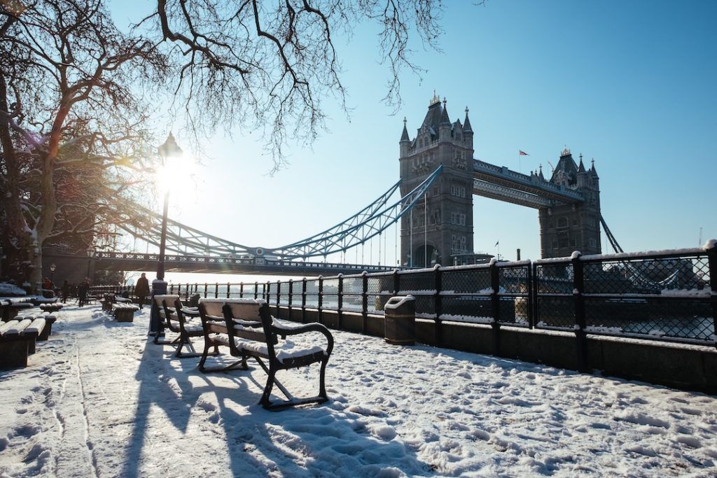tower bridge in the snow. London is one of the best places to visit in Europe in winter!