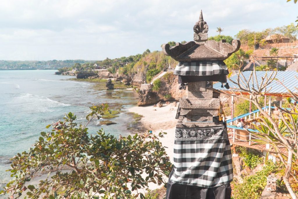 a pillar wrapped in gingham cloth on the cliffs of nusa cenigan