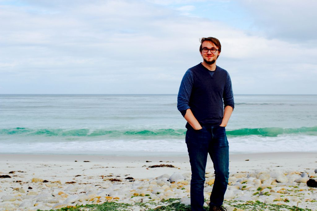 connor standing on the beach