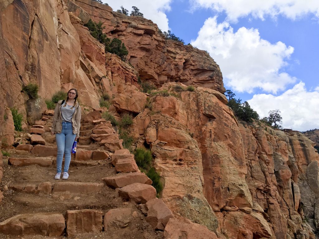 Addie standing on the steps of the South Kaibab Trail