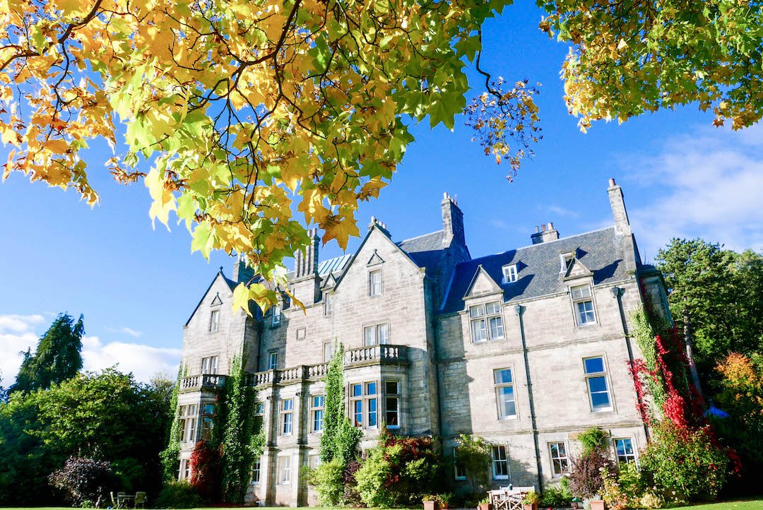 Pitreavie Castle in Dunfermline, Scotland framed by leaves