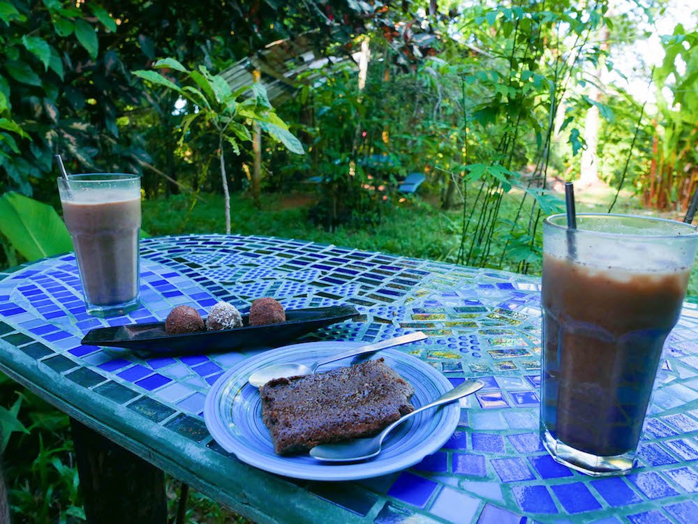 Truffles, a brownie, and mochas on a tiled table at Up in the Hill on Isla Bastimentos, Bocas del Toro, Panama