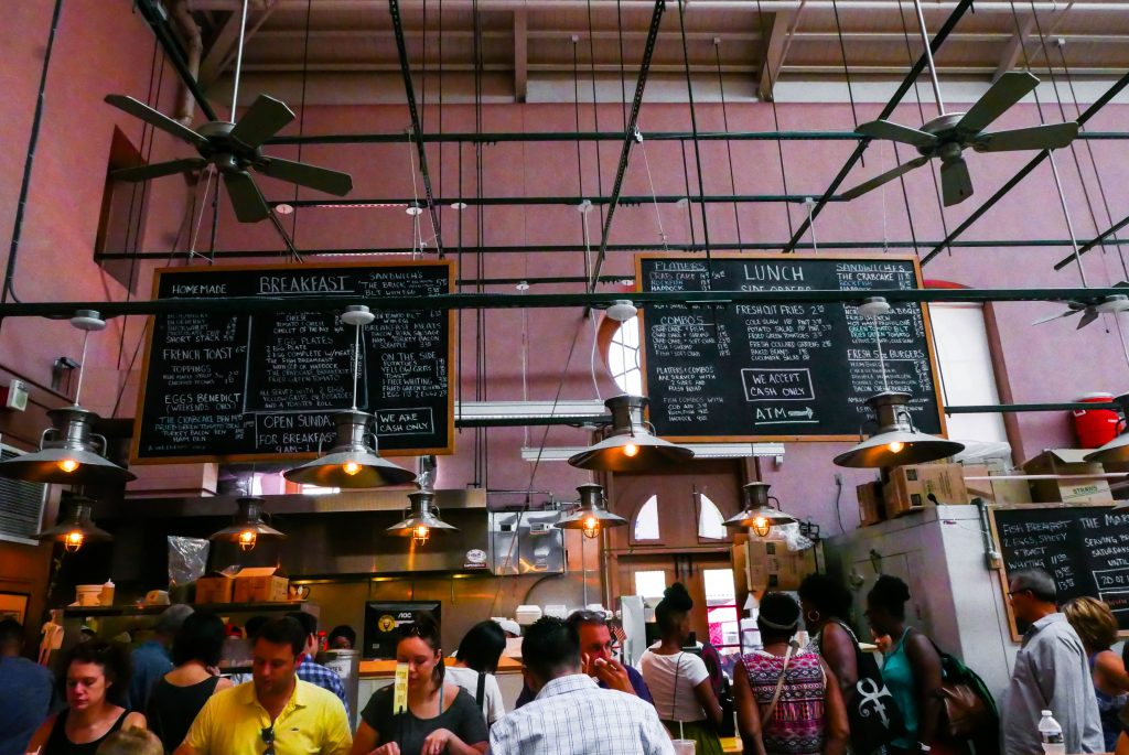 A pink wall and hanging menu boards in Eastern Market, Washington DC