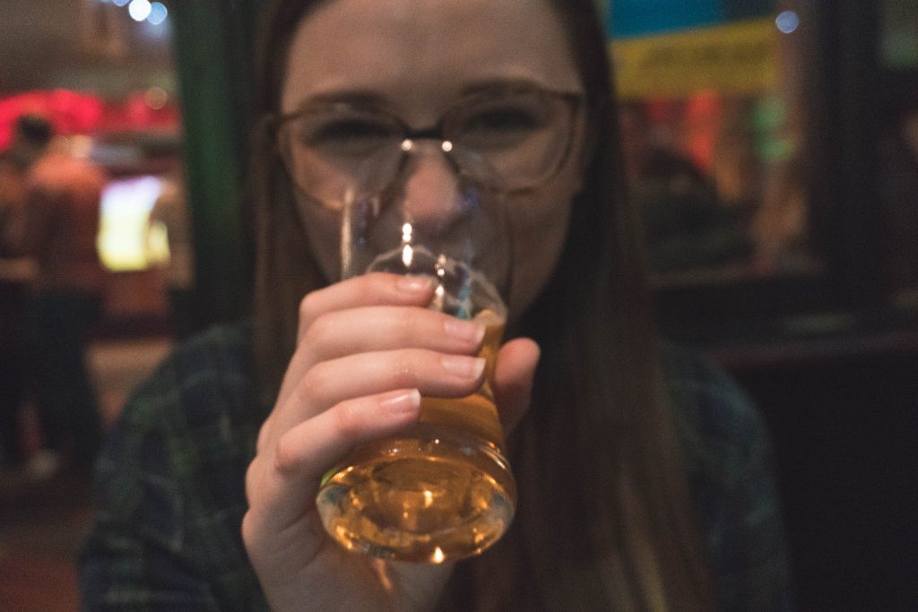 Addie drinking Cider at Sober Lane in Cork City Ireland