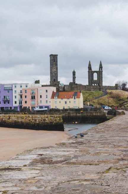 looking down the pier towards east sands and the cathedral in St. Andrews, Scotland
