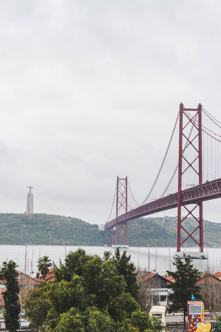 The Ponte de 25 Abril stretching across the water towards the Cristo Rei in Lisbon, Portugal