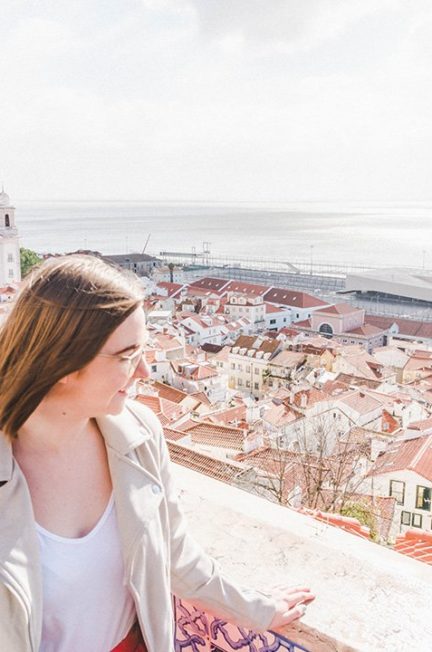 Addie staring out across Lisbon from a viewpoint