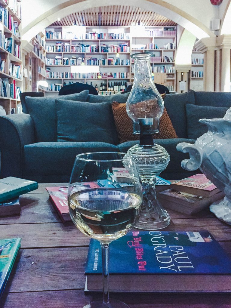 White wine on the table at Book and Cook Restaurant in Obidos, Portugal