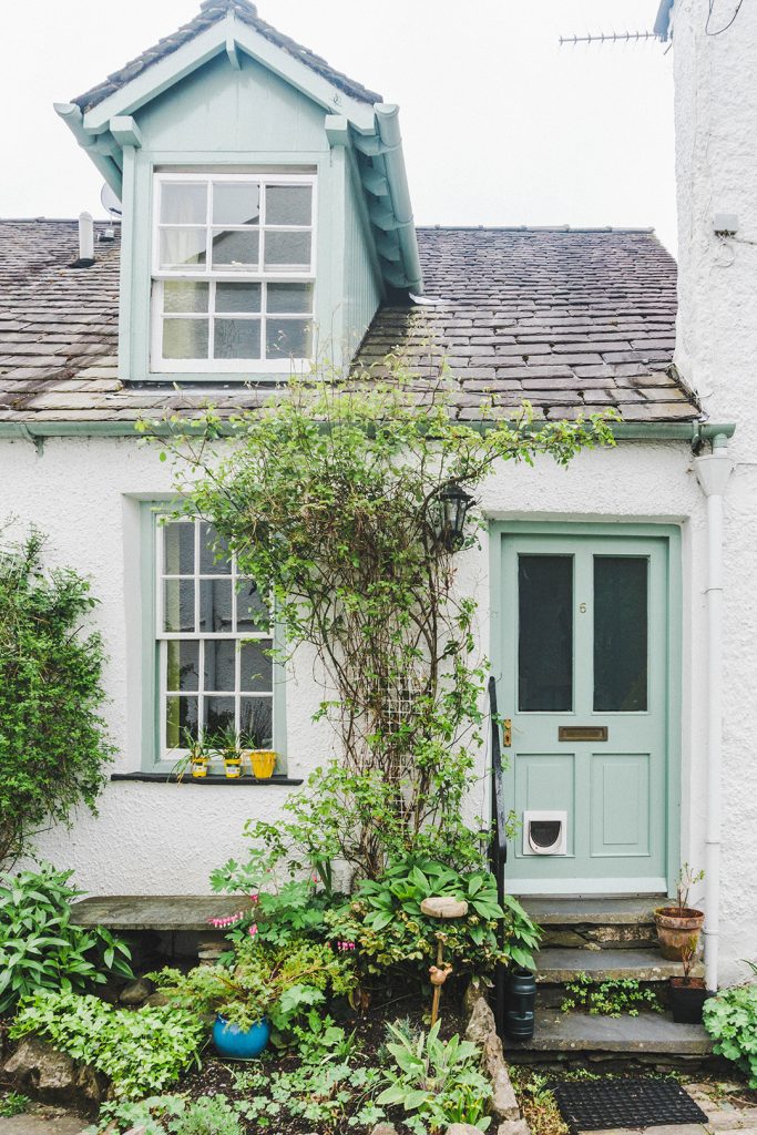 A cute white house with a blue door in Ambleside, Lake District, UK