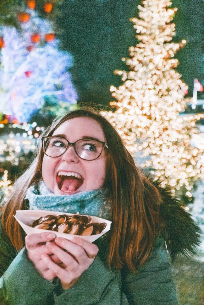 Addie freaking out over Aebelskiver at the Tivoli Gardens Christmas Market in Copenhagen