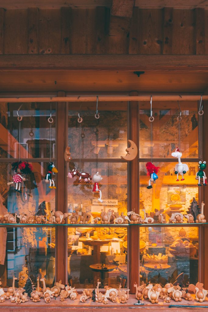 The window of a woodworkers filled with small wooden toys