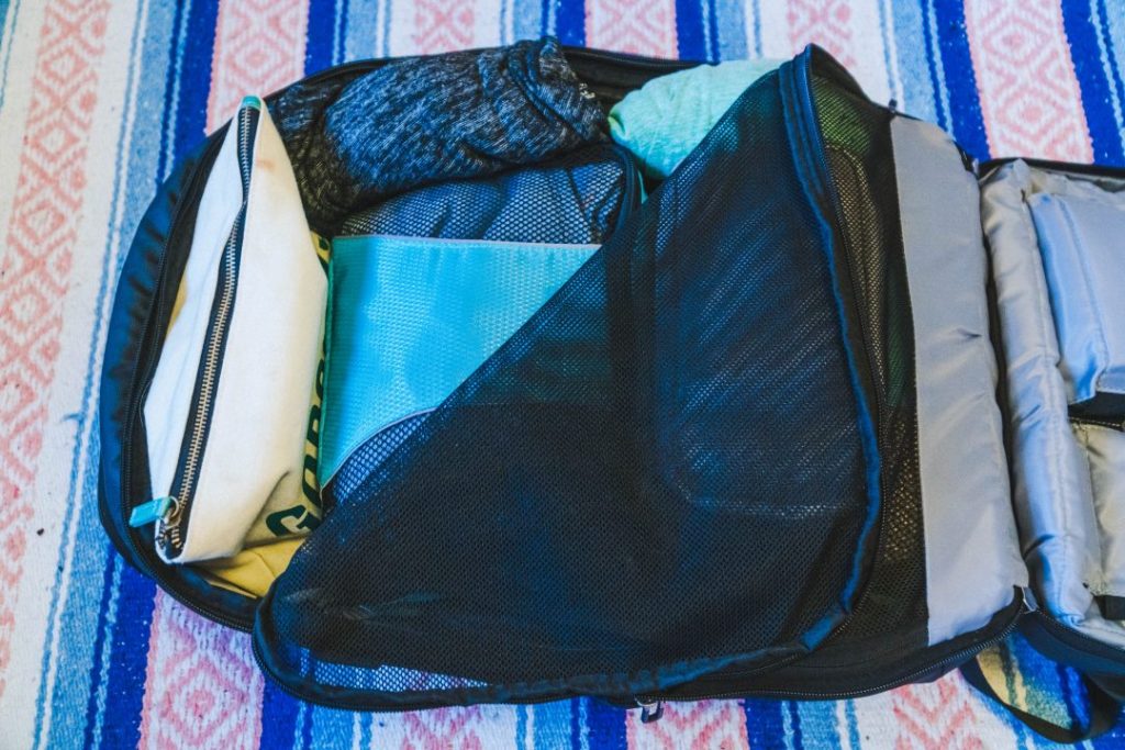 mesh cover folded back to reveal the contents of the backpack