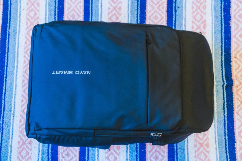 the nayosmart almighty backpack laying on the ground