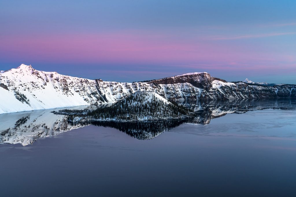 cater lake at twilight with snow on the mountains