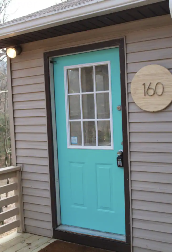 a bright turquoise door at one of the shenandoah national park cabins