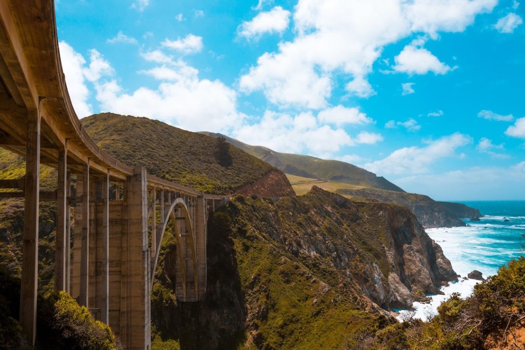 an arched concrete bridge along the cliffs of Big Sur